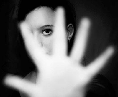 Hand with person in background in black and white